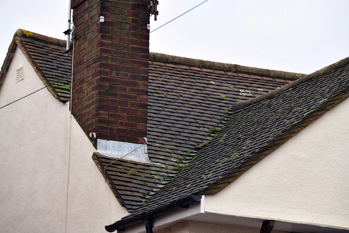 A house's roof with a gutter on the side
