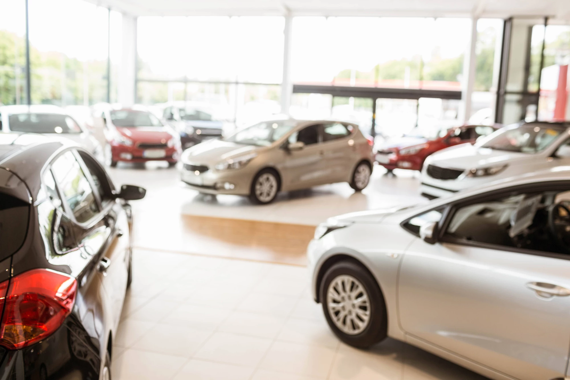 A car dealership's showroom with new cars on display