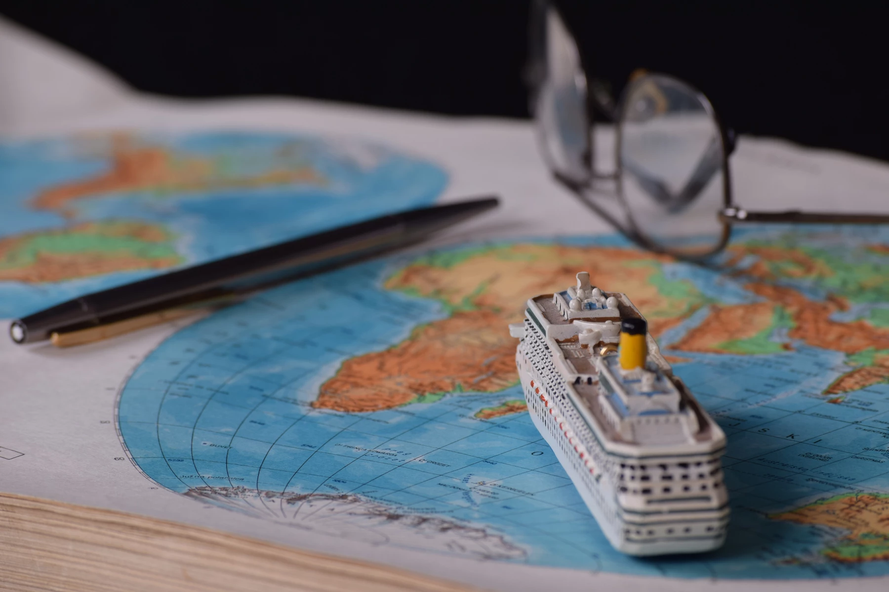 A model cruise ship on a map