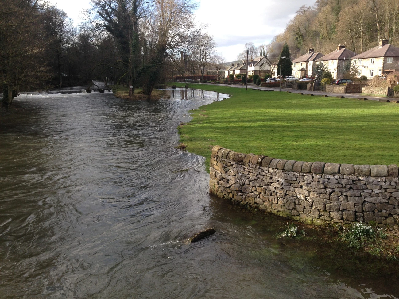 A river that has burst its banks in a residential area