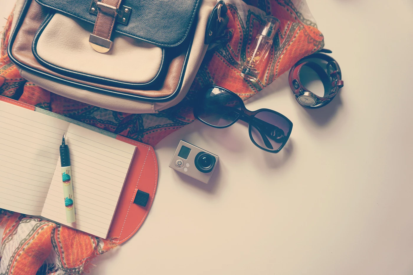 Travel essentials laid out on a table ready for travelling