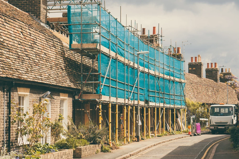 A building under construction with scaffolding in place 