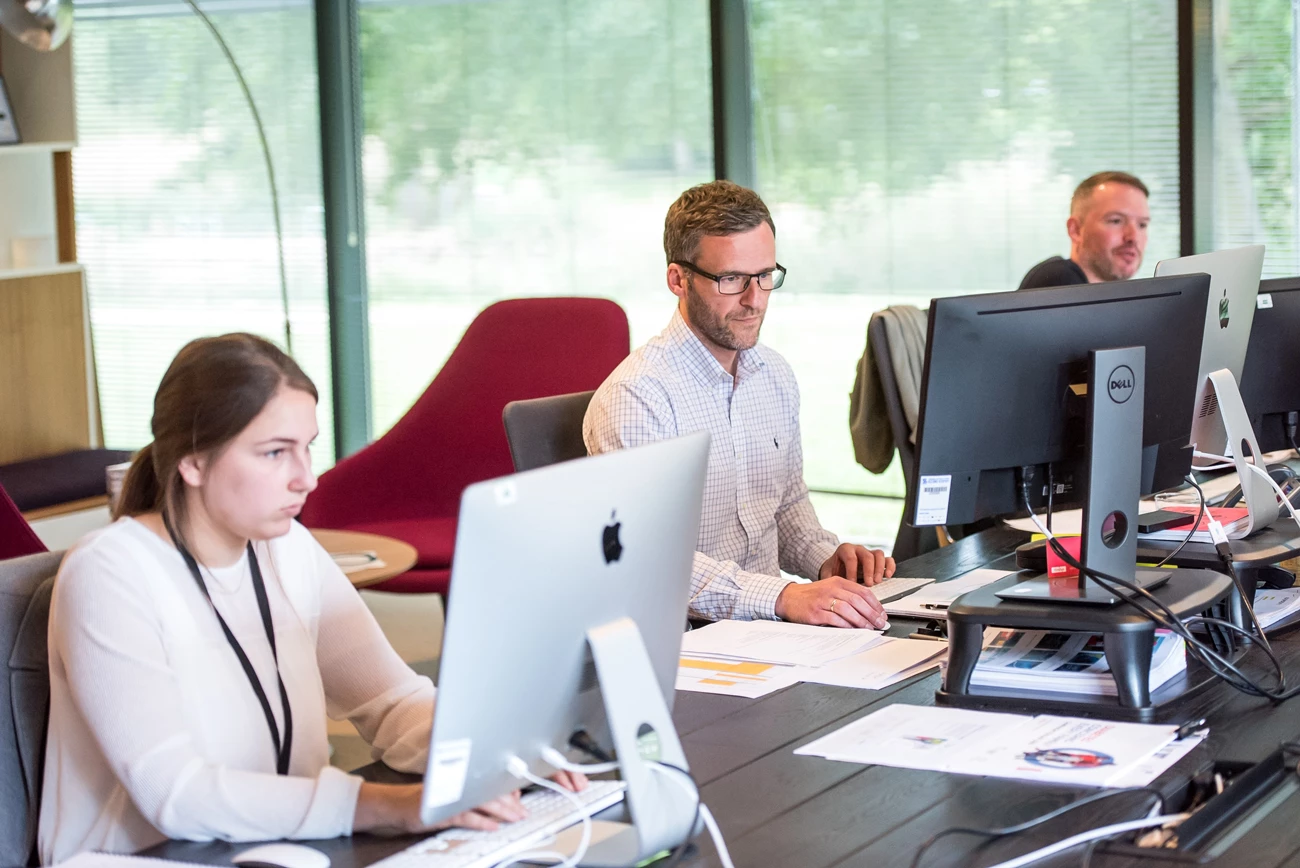 An after sales team working at desks in an office