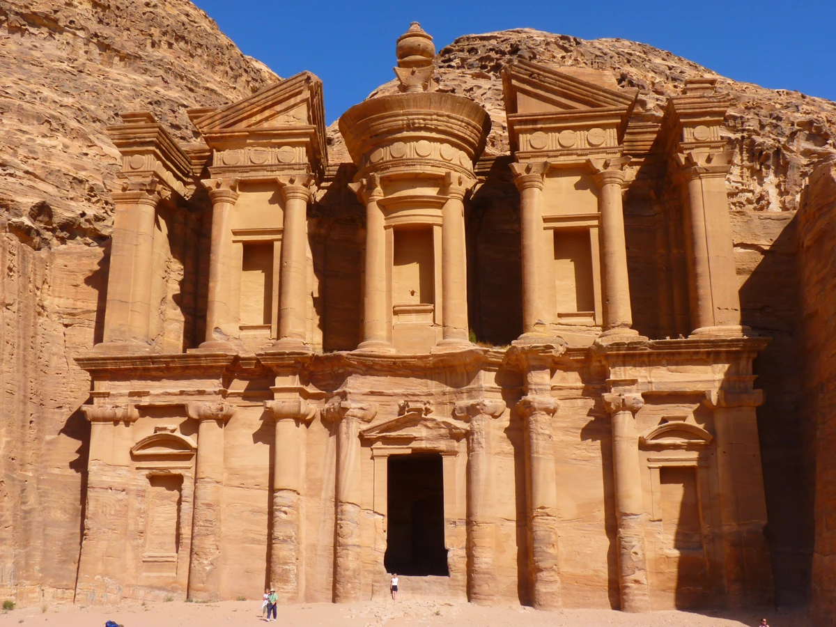 The colossal structure carved into the red rock at Petra in Jordan on a sunny day 