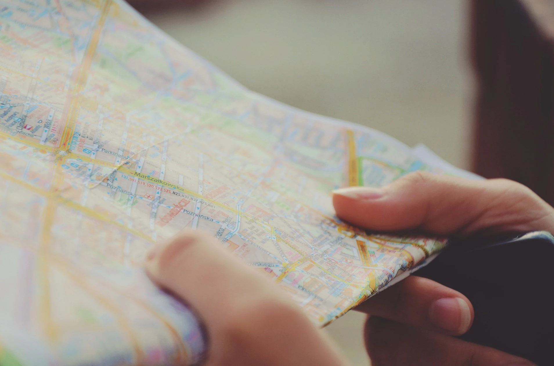 A person map reading to plan a journey