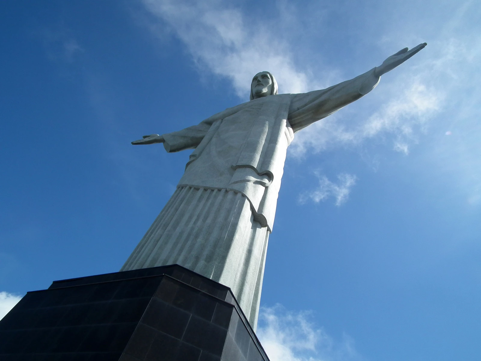 The huge statue of Christ the Redeemer on top of a mountain in Rio, Brazil