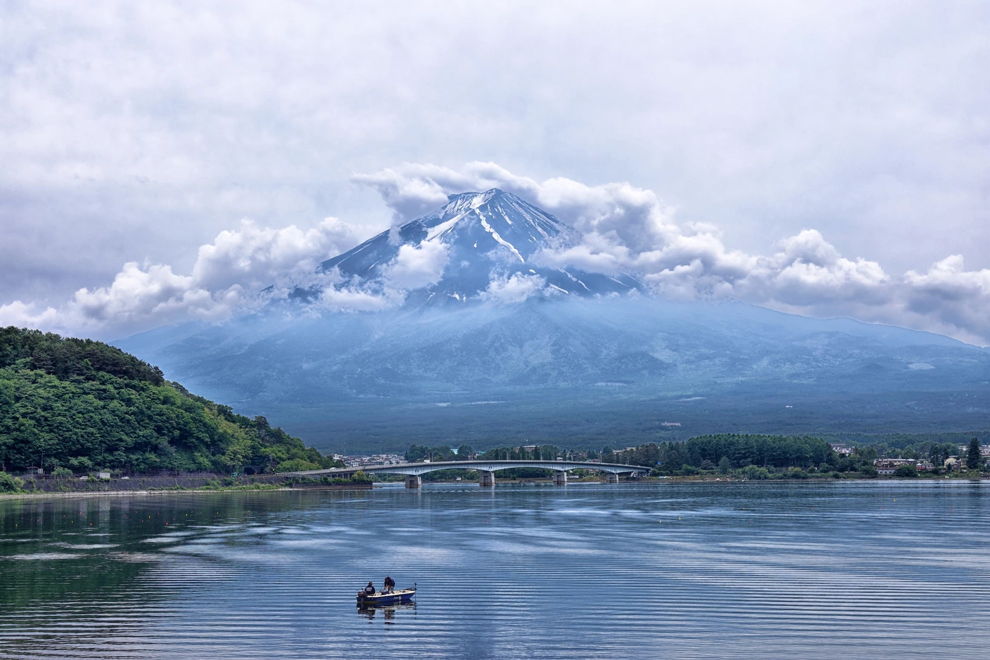 A scenic landscape across Japan with a lake and mountain in the background