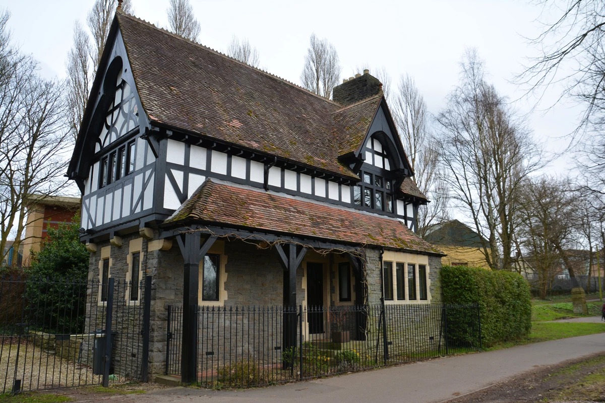 A Tudor style home with wooden beams visible 