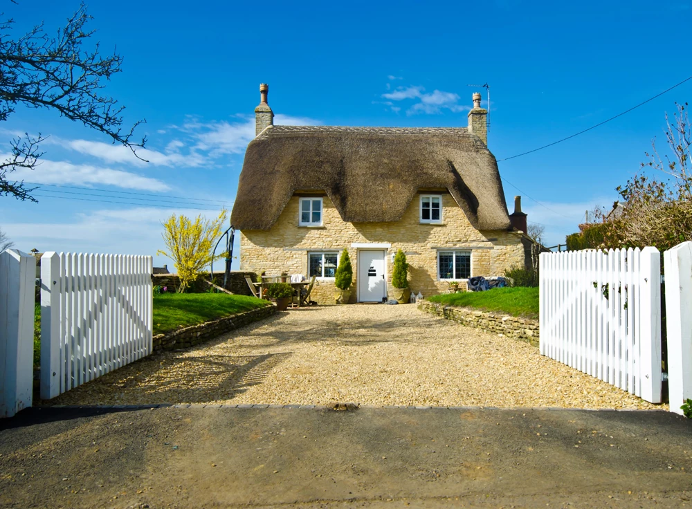 A detached thatched house in the country side